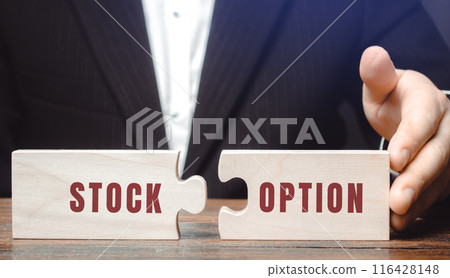 Stock option concept. Investor right to buy or sell a stock at an agreed-upon price and date. Business and finance. Puzzles in the hands of a businessman Stock option concept. Investor right to buy or sell a stock at an agreed-upon price and date. Business and finance. Puzzles in the hands of a businessman 116428148