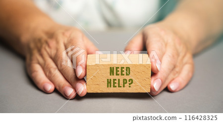 Wooden blocks Need help in a female hand. Concept of assistance and support services. Supported psychologically 116428325