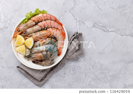 Raw shrimps on plate Raw shrimps on plate 116429059