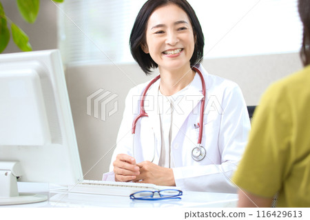 Middle-aged female doctor to see 116429613