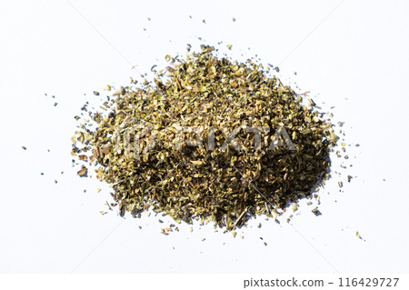 Dried herb mixture seasoning on white background, close-up, top view. 116429727