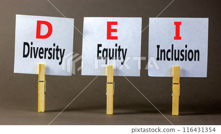 DEI diversity equity and inclusion symbol. Concept words DEI diversity equity inclusion on beautiful paper. Beautiful grey background. Business DEI diversity equity and inclusion concept. Copy space 116431354
