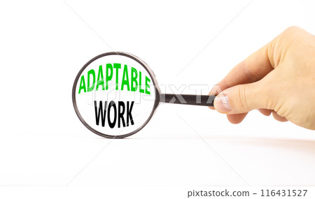 Adaptable work symbol. Concept words Adaptable work in beautiful magnifying glass. Beautiful white paper background. Businessman hand. Business Adaptable work concept. Copy space. Adaptable work symbol. Concept words Adaptable work in beautiful magnifying glass. Beautiful white paper background. Businessman hand. Business Adaptable work concept. Copy space. 116431527