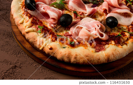 Pizza with prosciutto and mushrooms, bacon, olives, homemade, top view, no people, Pizza with prosciutto and mushrooms, bacon, olives, homemade, top view, no people, 116431630