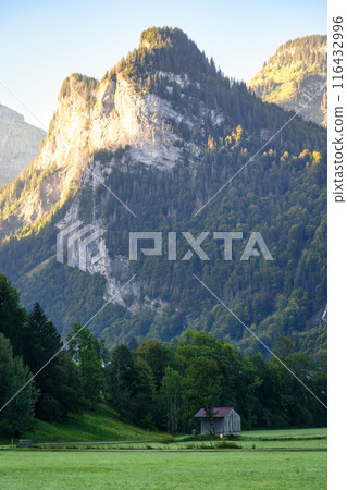 Rustic ski resort village with mountain range in Giffre valley at Sixt Fer a Cheval, France 116432996