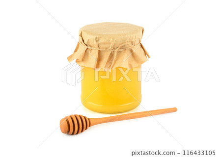 Honey pot and wooden drizzler isolated on white. Honey pot and wooden drizzler isolated on white. 116433105