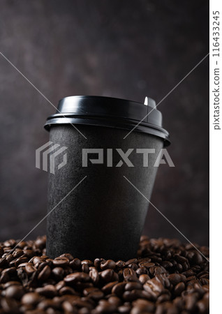 black paper cup with coffee beans on a dark background close up and macro. black paper cup with coffee beans on a dark background close up and macro. 116433245