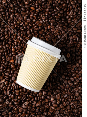 Yellow  paper cup with coffee  on a dark coffee beans background. The concept of eco and zero waste. 116433249