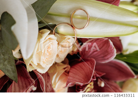 A bouquet of flowers with a mix of red and white flowers A bouquet of flowers with a mix of red and white flowers 116433311