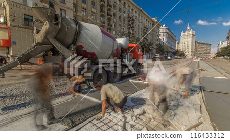 Concrete works for road construction with many workers and mixer timelapse Concrete works for road construction with many workers and mixer timelapse 116433312