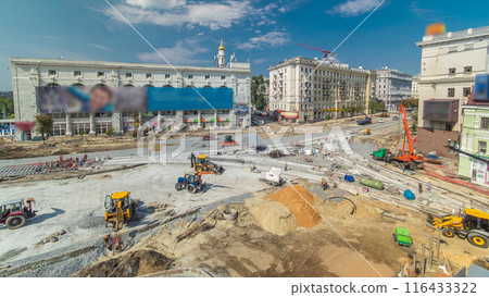 Concrete works for road construction with many workers and mixer timelapse 116433322