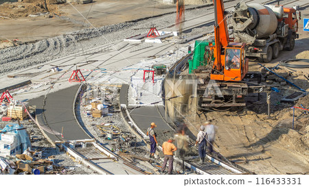 Concrete works for road construction with many workers and mixer timelapse Concrete works for road construction with many workers and mixer timelapse 116433331