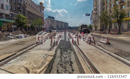 Tram rails at the stage of their installation and integration into concrete plates on the road timelapse Tram rails at the stage of their installation and integration into concrete plates on the road timelapse 116433347