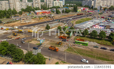 Aerial view of large road construction site with several industrial machines timelapse. Aerial view of large road construction site with several industrial machines timelapse. 116433391