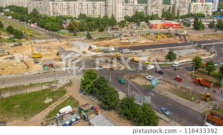 Aerial view of large road construction site with several industrial machines timelapse. Aerial view of large road construction site with several industrial machines timelapse. 116433392