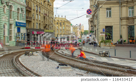 Workers with protective mask welding reinforcement for tram tracks in the city timelapse 116433417