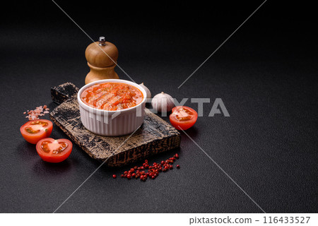 Red hot or spicy sauce with chili peppers, tomatoes, garlic, spices Red hot or spicy sauce with chili peppers, tomatoes, garlic, spices 116433527