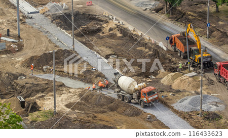 Concrete works for road construction with many workers and mixer timelapse Concrete works for road construction with many workers and mixer timelapse 116433623