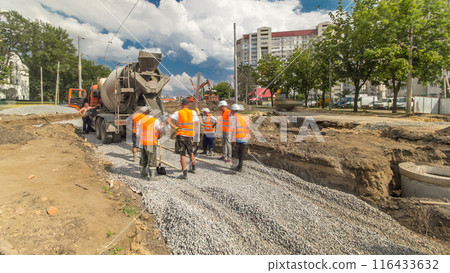 Concrete works for road maintenance construction with many workers and mixer timelapse Concrete works for road maintenance construction with many workers and mixer timelapse 116433632