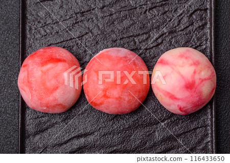 Delicious colorful asian mochi sweets with rice dough shell 116433650