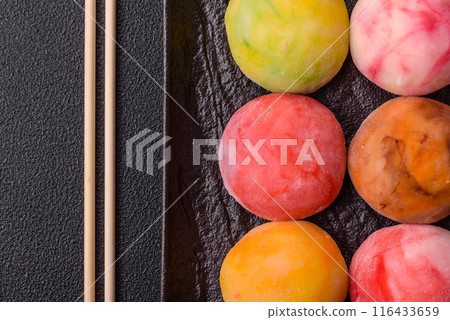 Delicious colorful asian mochi sweets with rice dough shell Delicious colorful asian mochi sweets with rice dough shell 116433659
