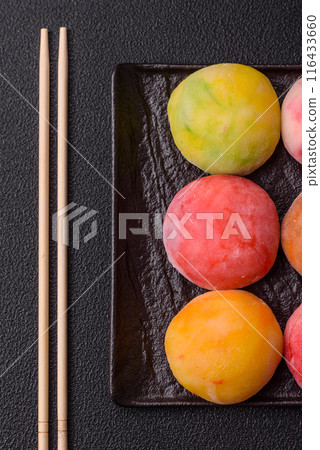 Delicious colorful asian mochi sweets with rice dough shell Delicious colorful asian mochi sweets with rice dough shell 116433660