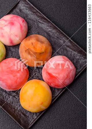 Delicious colorful asian mochi sweets with rice dough shell Delicious colorful asian mochi sweets with rice dough shell 116433663