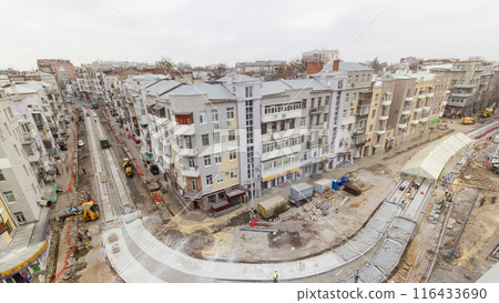 Covering concrete for road maintenance construction site with many workers and mixer timelapse 116433690