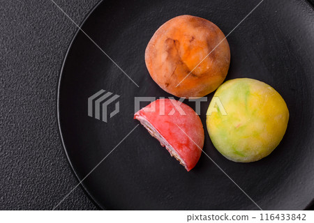 Delicious colorful asian mochi sweets with rice dough shell Delicious colorful asian mochi sweets with rice dough shell 116433842