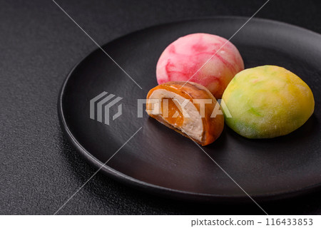 Delicious colorful asian mochi sweets with rice dough shell Delicious colorful asian mochi sweets with rice dough shell 116433853