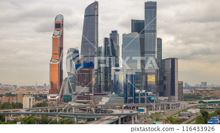 Business complex of skyscrapers Moscow city timelapse. In the foreground the railway and automobile overpass. Business complex of skyscrapers Moscow city timelapse. In the foreground the railway and automobile overpass. 116433926