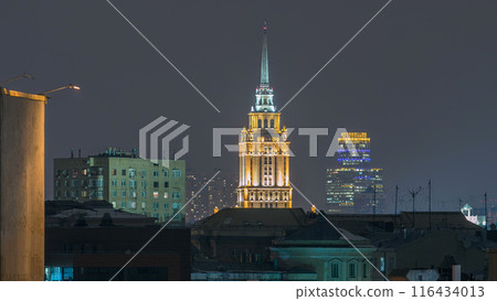 Hotel Ukraine with roofs timelapse, landmark near historic center of Moscow. Cityscape in snowy winter evening. Hotel Ukraine with roofs timelapse, landmark near historic center of Moscow. Cityscape in snowy winter evening. 116434013