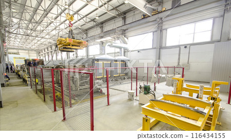 The operator lifting device timelapse, lift loads using lifting magnet, mechanical workshop, metal structures plant. The operator lifting device timelapse, lift loads using lifting magnet, mechanical workshop, metal structures plant. 116434155