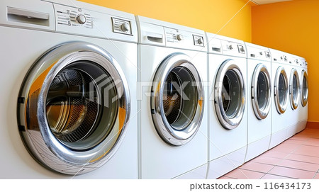 A snapshot of modern convenience - these washing machines, resplendent in their metallic glory, wait patiently for their next load, promising cleanliness and freshness 116434173