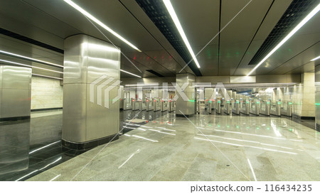 Interior of a modern subway station with turnstile timelapse hyperlapse 116434235