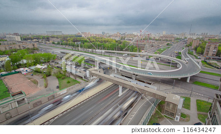 Traffic jams of roadside, transportation motion in a big city. Rush hour traffic on a city roads aerial timelapse. Traffic jams of roadside, transportation motion in a big city. Rush hour traffic on a city roads aerial timelapse. 116434247
