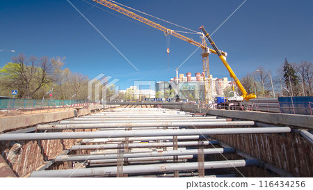 A large huge ditch pit tunnel timelapse hyperlapse at the construction site of the underground metro station line. A large huge ditch pit tunnel timelapse hyperlapse at the construction site of the underground metro station line. 116434256