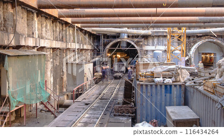 A large huge ditch pit tunnel timelapse at the construction site of the underground metro station line. A large huge ditch pit tunnel timelapse at the construction site of the underground metro station line. 116434264