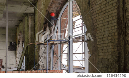 Construction worker using drill to install window timelapse Construction worker using drill to install window timelapse 116434298