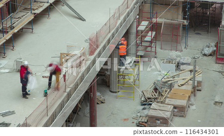 Construction equipment material with scaffolding and tools inside the floor of high rising building timelapse Construction equipment material with scaffolding and tools inside the floor of high rising building timelapse 116434301