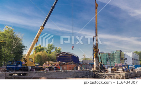 Huge ditch pit at the construction site of the underground metro station line timelapse. Huge ditch pit at the construction site of the underground metro station line timelapse. 116434307