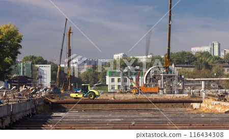Huge ditch pit at the construction site of the underground metro station line timelapse. Huge ditch pit at the construction site of the underground metro station line timelapse. 116434308