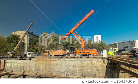 Huge ditch pit at the construction site of the underground metro station line timelapse. Huge ditch pit at the construction site of the underground metro station line timelapse. 116434309