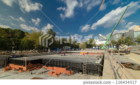 Bricklayers laying bricks to make a walls timelapse. 116434317