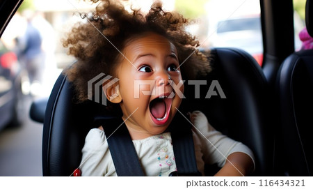With a sense of adventure and anticipation, the happy child eagerly awaits the next destination from their cozy car seat 116434321