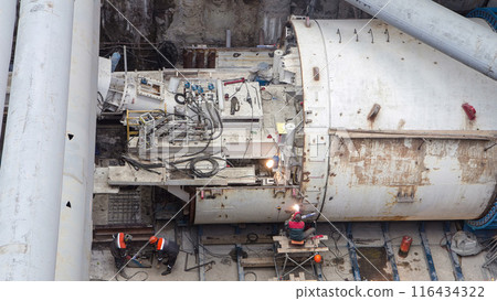 Welder fixing tunnel roring machine at subway construction site timelapse 116434322