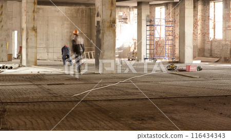 Construction equipment material with scaffolding and tools inside the floor of high rising building timelapse 116434343
