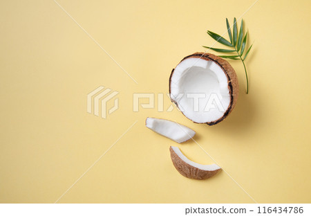 Concet of eco frendly flat lay. Fresh coconut and slices  on yellow  background.  116434786