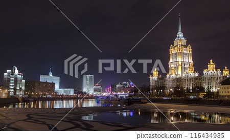 Hotel Ukraine winter night timelapse hyperlapse with bridge over Moscow River. Hotel Ukraine winter night timelapse hyperlapse with bridge over Moscow River. 116434985