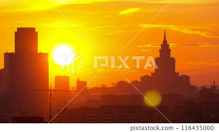 Moscow. Stalin skyscraper on the background of a large the sunset sun timelapse, Russia Moscow. Stalin skyscraper on the background of a large the sunset sun timelapse, Russia 116435000